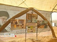 گشایش نمایشگاه عکس سنگر سازان بی سنگر در یادمان علقمه